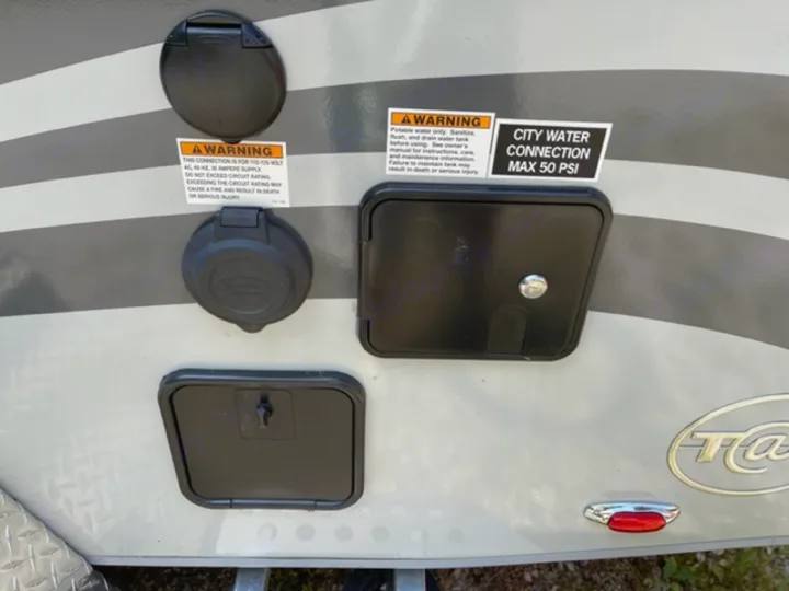 Crucial RV rental hookups: 30A power and city water (max 50 PSI) connections, plus lower service access points.. NuCamp T@G MAX XL BOONDOCK 2021