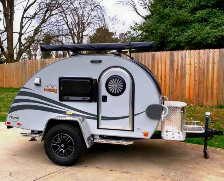 A light gray nuCamp T@G Boondock teardrop rv rental, ready for off-grid camping adventures.. NuCamp T@G MAX XL BOONDOCK 2021