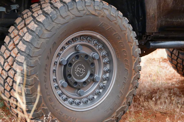 Close-up of a dirt-covered BFGoodrich Mud-Terrain tire on a Black Rhino wheel, ready for your RV rental adventure.. Toyota 4Runner 2013