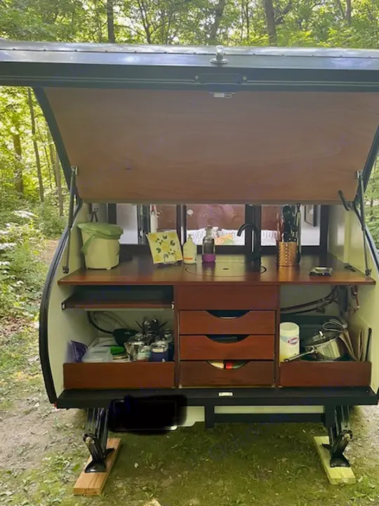 RV rental: See this compact teardrop camper's fully equipped galley kitchen, perfect for outdoor cooking.. Driftwood Trailers Other 2022