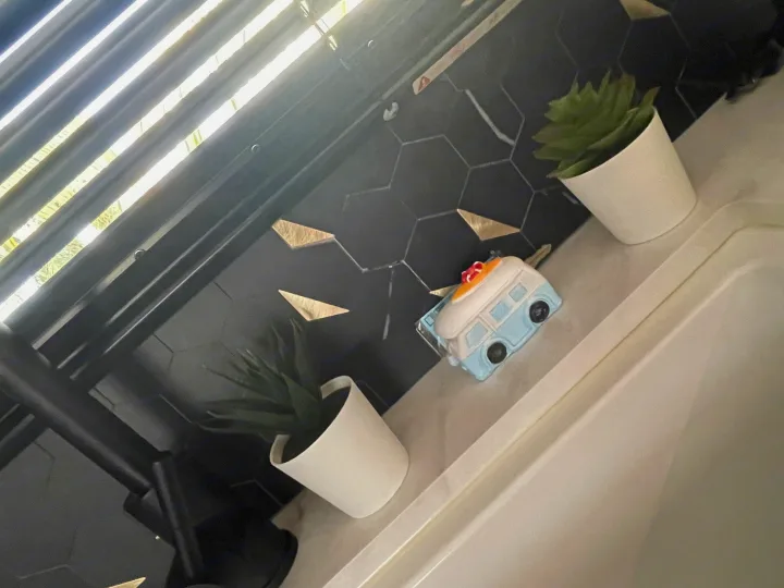 Stylized decor in an RV rental: a blue camper, succulents, and black hexagonal tiles with gold accents.. Jayco JAYCO JAY FLIGHT SLX 264BH 2022