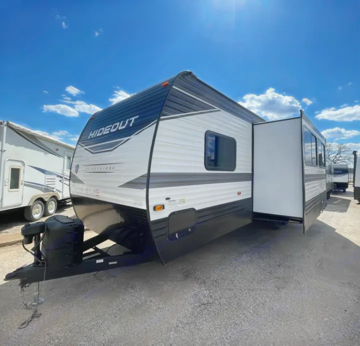 This white & black Keystone Hideout travel trailer with an extended slide-out is ready for your next RV rental adventure.. Keystone Hideout 2022