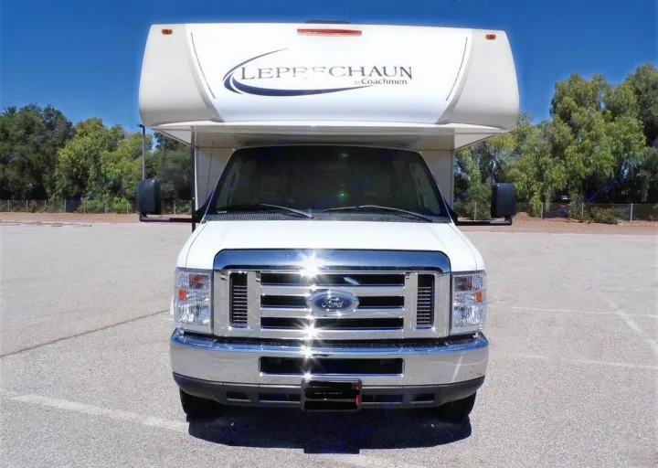 Front view of a white Ford Leprechaun Class C RV rental, ready for your road trip or camping adventure.. Forest River Coachmen Leprechaun 2018