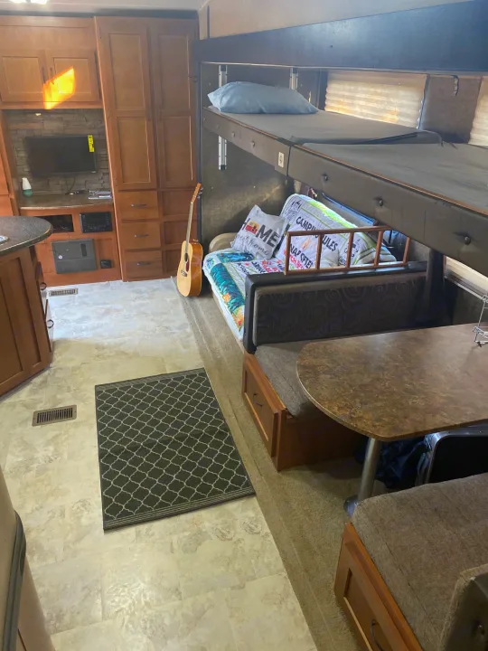 Bunk beds , kitchen table , sofa bed . Forest River Cherokee Grey Wolf 2014