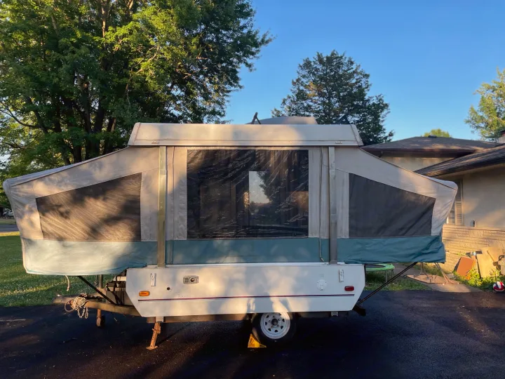 Pop-up camper fully extended, ready for an RV rental. This compact RV is perfect for your next camping trip.. Coleman Destiny Taos 1996