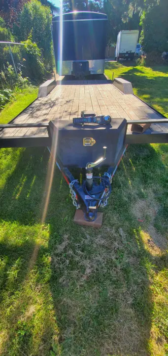 Black enclosed cargo trailer on a utility trailer. Perfect for gear hauling for your next RV rental trip.. Eagle flatbed 2019