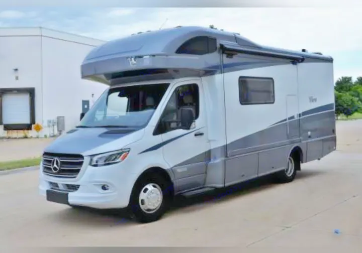 A sleek white and gray Mercedes-Benz Sprinter RV rental, ideal for travel adventures.. Winnebago View 2023