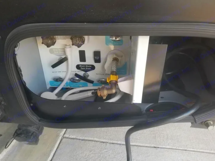 RV rental utility bay: controls for fresh water, gray/black waste tanks & drains, with pump switch.. Winnebago View 2023