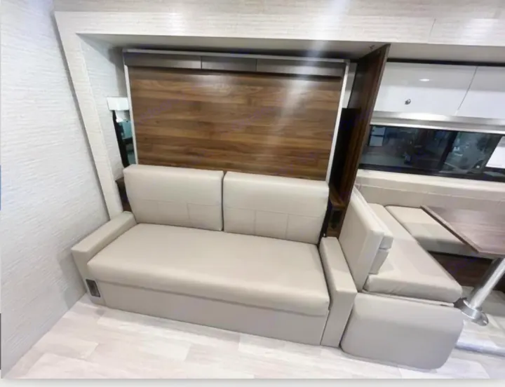 RV rental: Light gray multi-functional sofa and dinette in a modern RV interior, designed for flexible living.. Winnebago View 2022