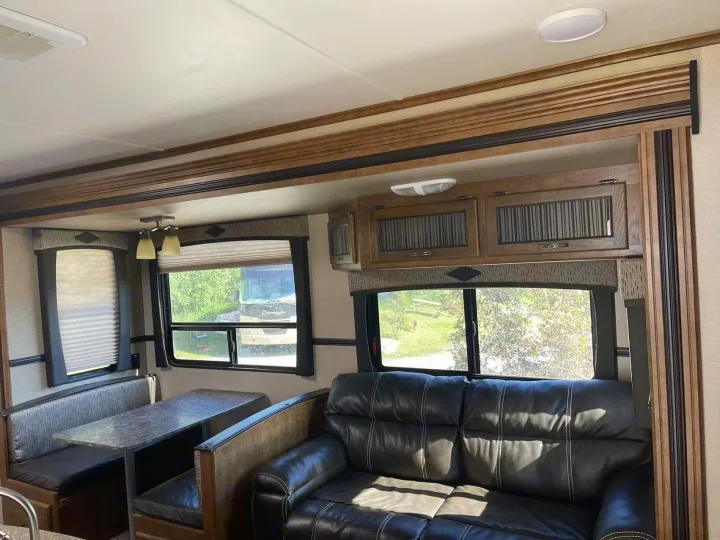 RV rental: Bright, spacious interior with a dinette, leather sofa, overhead storage, and scenic window views.. Crossroads RV Rezerve 2016