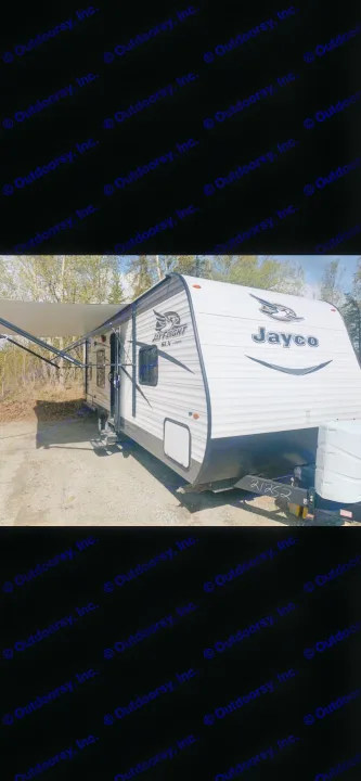 Jayco Jay Flight SLX RV rental with awning extended, parked in a scenic outdoor setting.. Jayco Jay Flight 2017