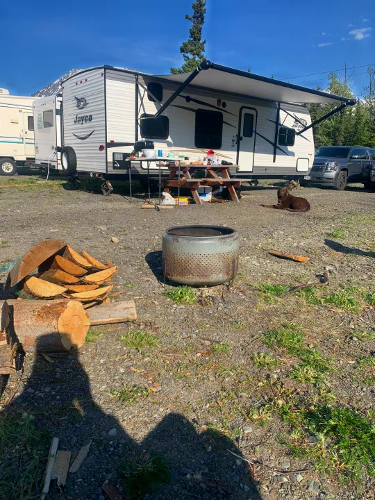 This RV rental is set up for camping with a Jayco travel trailer, picnic table, dog, and DIY fire pit.. Jayco Jay Flight 2017
