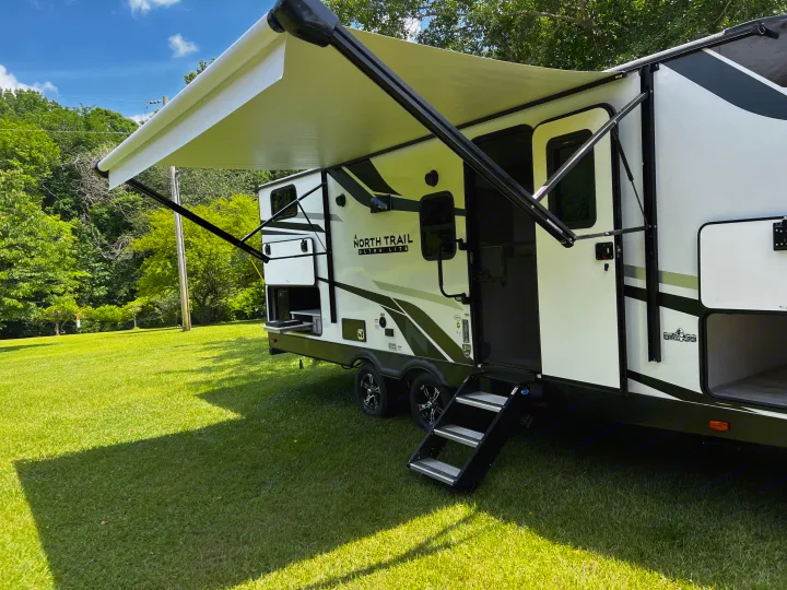 Awning with LED lights and outdoor kitchen . Heartland RVs North Trail 2022