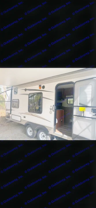 White travel trailer RV rental with extended awning and open door, showing the interior. Great for your next camping trip!. Jayco Jay Flight 2017