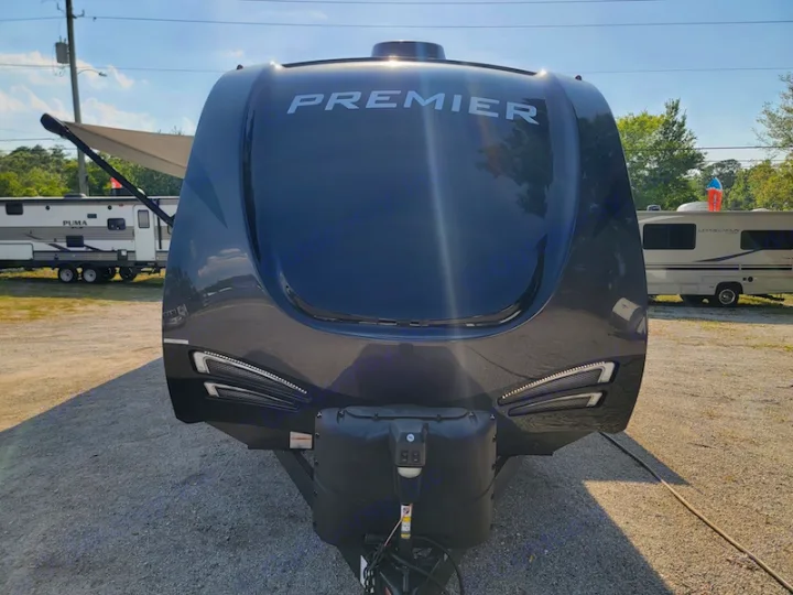 Front view of a modern Premier travel trailer, available for RV rental adventures.. Keystone RV Premier UltraLite 29RKPR 2021