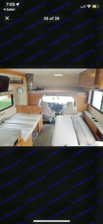 Bright Class C RV rental interior with dinette, bunk over cab, and sofa seating, offering comfortable living space.. Winnebago Minnie Winnie 2019