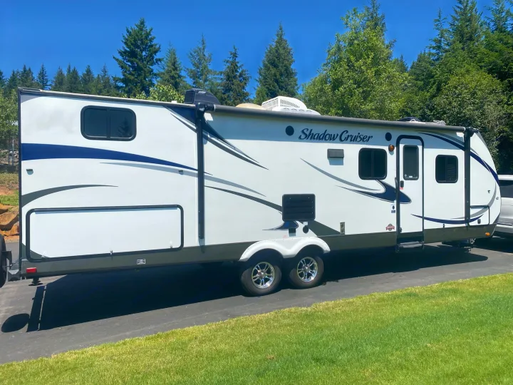 This sleek white "Shadow Cruiser" travel trailer is an ideal RV rental for your next outdoor adventure.. Cruiser Rv Corp 280Bunkhouse Cruiser 2015