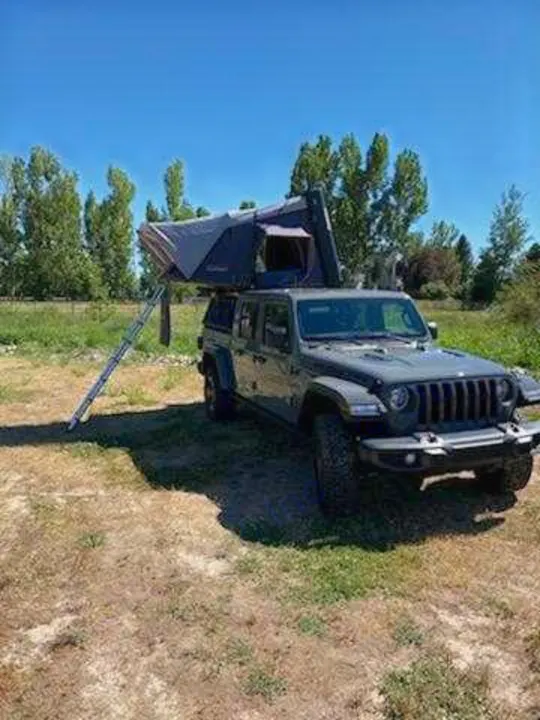RV rental: Dark grey Jeep with deployed rooftop tent & ladder. Perfect for camping adventures!. Other Other 2021