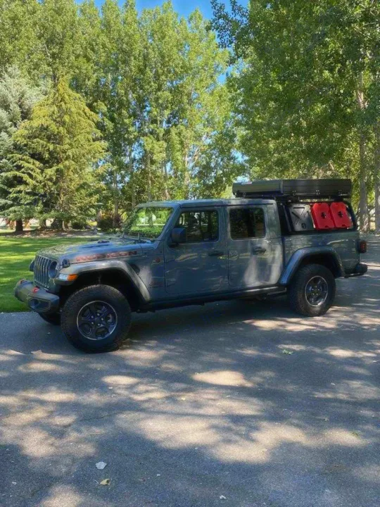 Explore off-road with this Jeep Gladiator rv rental, featuring a roof-top tent & fuel cans for your adventure camping!. Other Other 2021