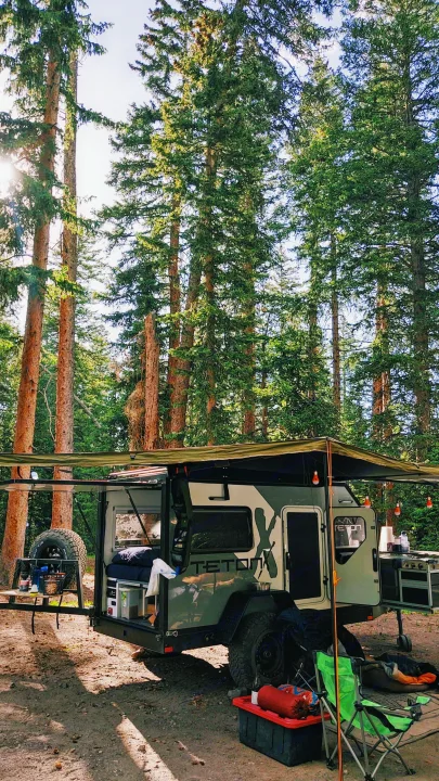 Adventure awaits! This off-grid teardrop **rv rental** in a serene forest setting offers the perfect escape for camping & outdoor fun.. TetonX Porter 2022