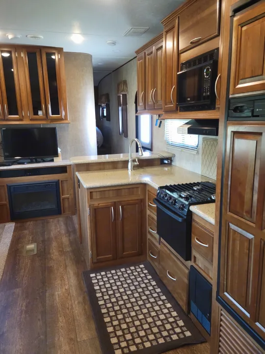 This **RV rental** features a full kitchen, living area with TV and fireplace, and a spacious bedroom beyond.. Crusader Crusader Fifth Wheel 2016