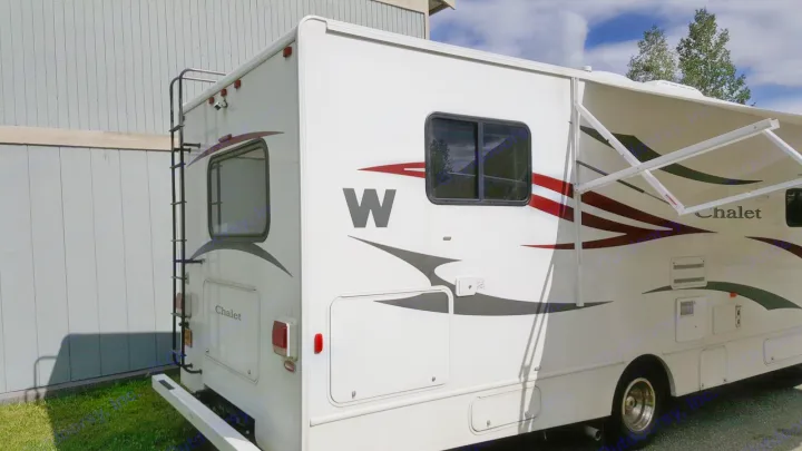 White Chalet motorhome RV rental with extended awning & rear ladder. Ideal for your next road trip.. Winnebago Chalet 2013