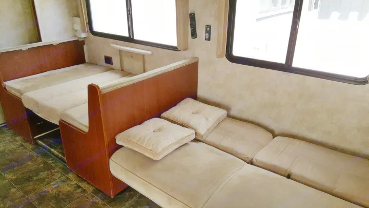 This RV rental features a versatile dinette that converts to a bed, plus a long bench seat for comfortable travel.. Winnebago Chalet 2013