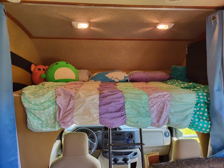 Over cab bunk set up for sleeping. Jayco Redhawk 2013