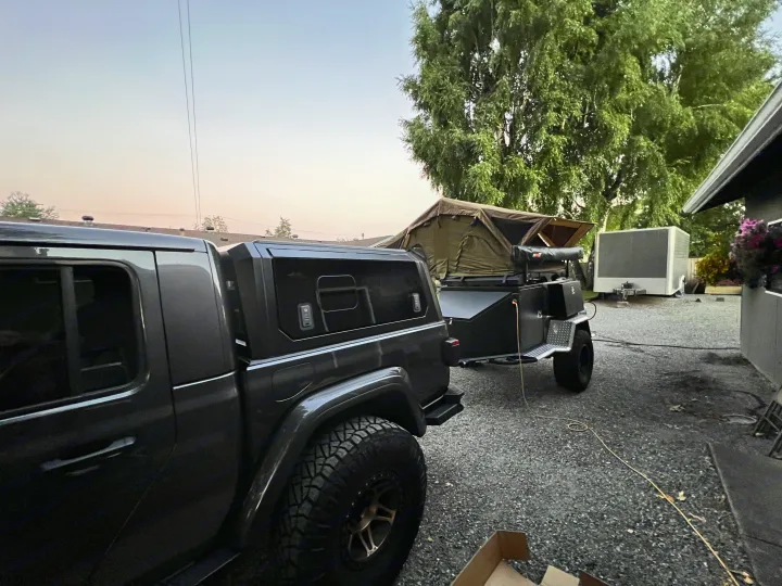 Dark truck with an overland trailer and rooftop tent deployed, a complete setup for an rv rental adventure.. Vorsheer Vorsheer Trailer 2022