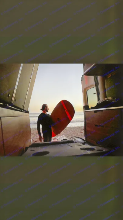 Surfer with board at sunset on beach, viewed from inside an RV rental. Ocean waves and colorful sky.. Mercedes-Benz Sprinter “144” 2020