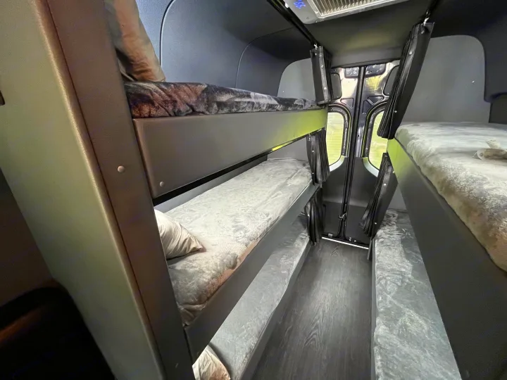 Step inside this RV rental featuring comfortable multi-level bunk beds & sleeping areas on both sides, ready for your adventure.. Mercedes Sprinter Motorhome Campervan RV 2021