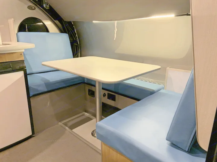 The dinette cushions have been upgraded with sky blue imitation leather. Looks great and super easy to clean up spills!. Safari Condo Alto R1723 Bunkhouse 2022
