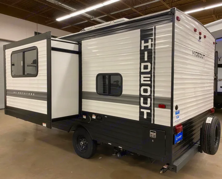 Explore this Hideout by Keystone travel trailer, ideal for an RV rental. Its extended slide-out offers extra living space.. Keystone RV Hideout 2022