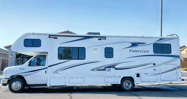 Side view of a white Forester Class C RV, an excellent rv rental option for your next travel adventure.. Forester LE 2020