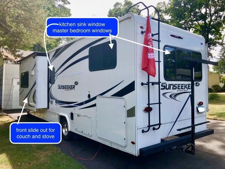 White Sunseeker RV rental with an extended front slide-out, rear windows for kitchen/bedroom, and ladder/rack on back.. Forest River Sunseeker LE 2020
