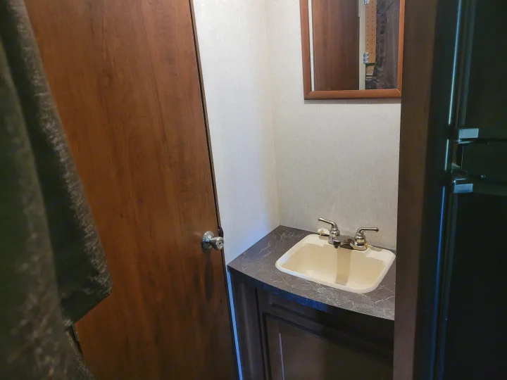 RV rental interior: compact bathroom with sink, faucet, and mirror.. Jayco Jay Flight SLX 2017