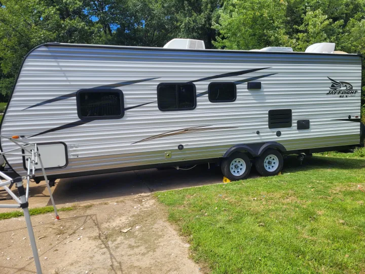 Jayco Jay Flight SLX travel trailer, perfect for your RV rental adventure. This RV is parked outdoors on a sunny day.. Jayco Jay Flight SLX 2017