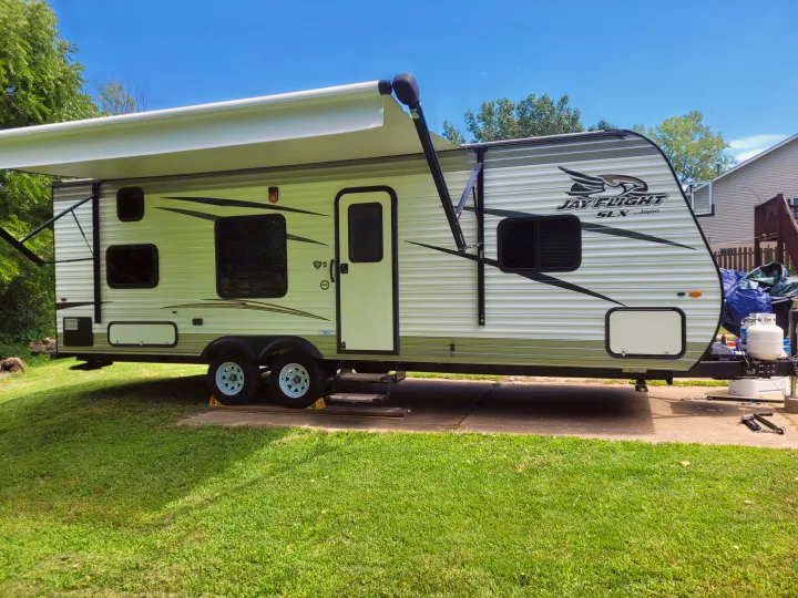This Jay Flight SLX travel trailer RV rental is set up with its awning extended, ready for your next outdoor adventure.. Jayco Jay Flight SLX 2017
