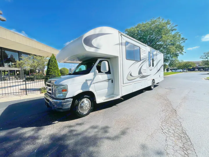 This white Greyhawk RV rental is a Class C motorhome, ready for adventure on a sunny day.. Jayco Greyhawk 2013
