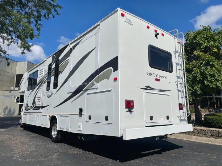This white Jayco Greyhawk RV rental is ready for adventure! See its sleek design, ample storage, and rear ladder for travel.. Jayco Greyhawk 2013