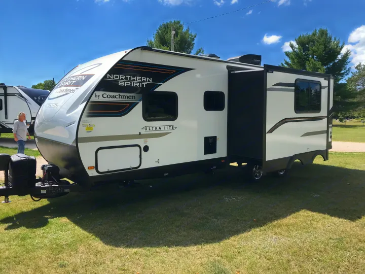 Experience camping in a white Northern Spirit travel trailer, with a slide-out. Perfect RV rental for your next road trip!. Other Other 2022