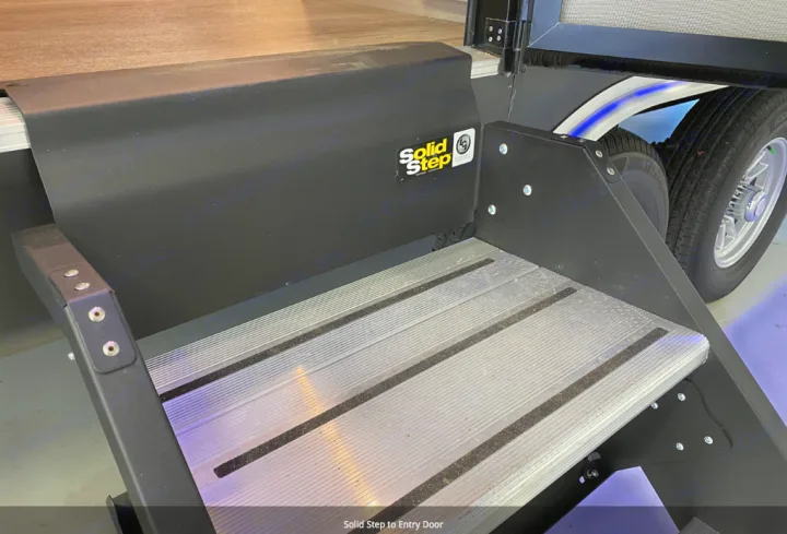 Solid Step aluminum entry steps with black frame for an RV rental, leading to the door.. Forest River Coachmen Catalina Legacy 2022