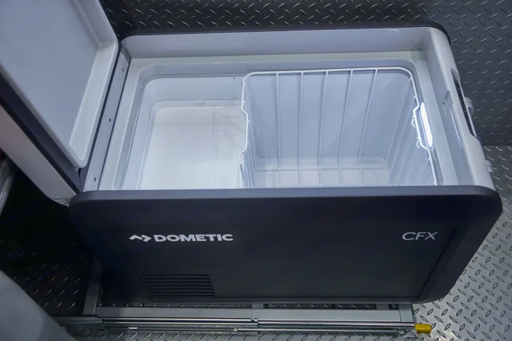 Open Dometic CFX portable fridge for RV rental, ideal for keeping food and drinks cool on road trips.. Chevrolet silverado 2500 2022