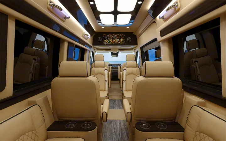 Explore in comfort! This luxurious RV rental interior boasts plush seating, a TV, and ambient lighting for premium travel.. Ultimate Toys Ultimate Coach 2023