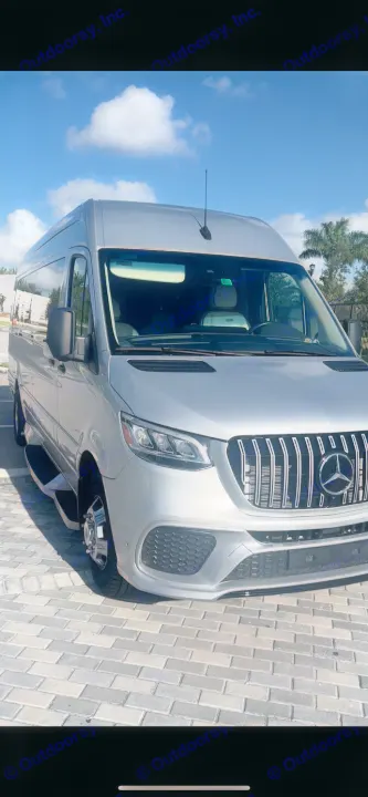 Experience travel in style: a silver Mercedes-Benz Sprinter van with custom grill, perfect for an RV rental adventure.. Ultimate Toys Other 2022