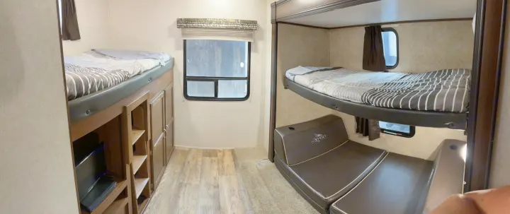 RV rental interior: multiple bunk beds, a convertible sofa, and storage for a cozy travel experience.. Jayco Jay Flight 2016