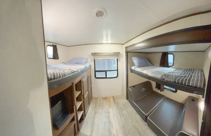 Cozy RV rental bunkhouse: multiple beds, convertible seating, and storage, ideal for family trips.. Jayco Jay Flight 2016