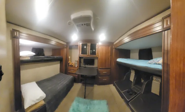 RV rental interior features comfortable bunk beds, a dining table, and seating areas.. Jayco Eagle 2016