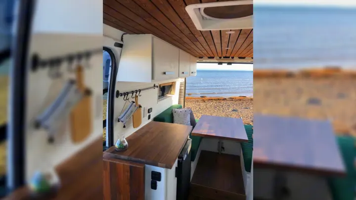 This stunning RV rental features a cozy interior with wooden accents and a breathtaking beach view, perfect for your next adventure.. RAM Promaster 2500 2017