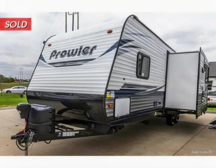 A Prowler travel trailer RV rental, showcasing its extended side slide-out.. Heartland RVs Prowler 2021